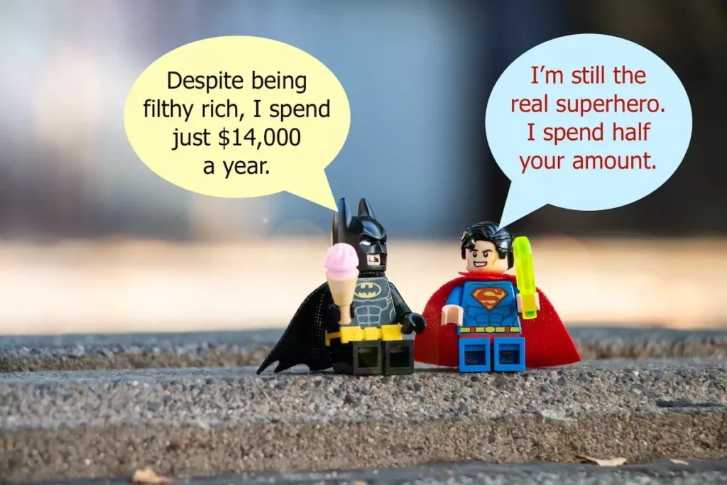 meme: batman and superman having conversion: I'm the real superhero. I spend half your amount.