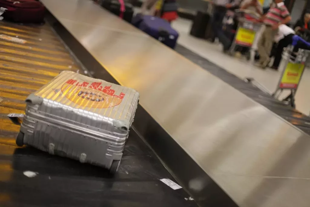 luggage on airport's baggage collection carousel belt