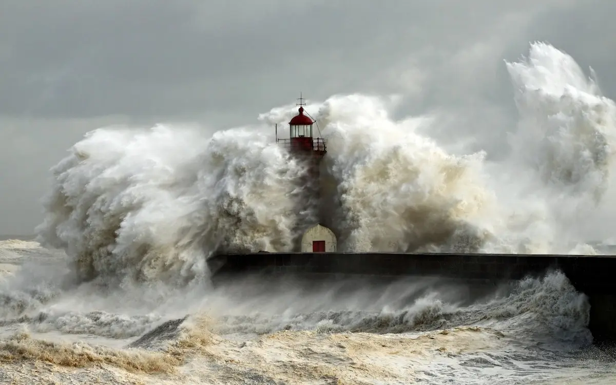 tsunami wave hitting lighthouse