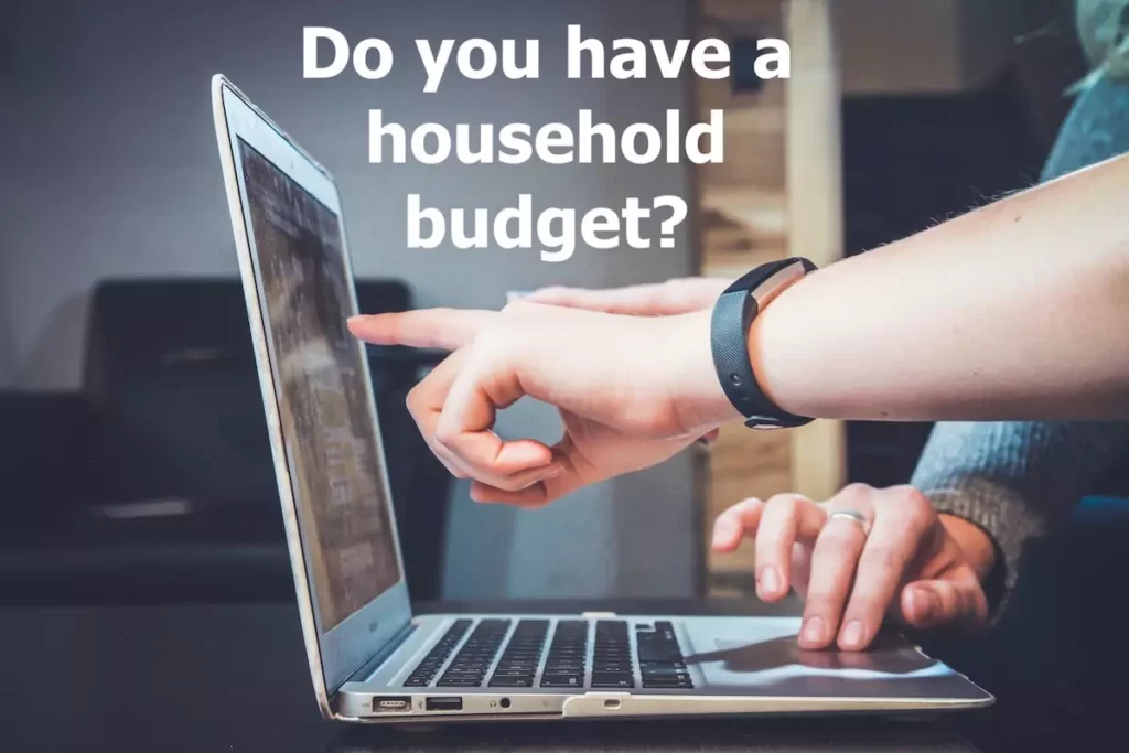 Image of fingers pointing to a laptop's screen. Quote: Do you have a household budget?