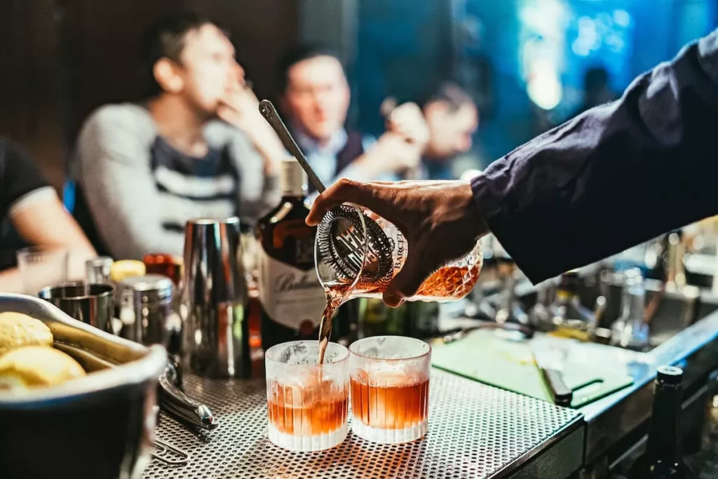 Image of bartender pouring a drink