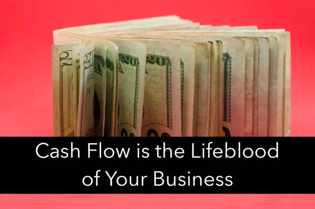 Image of a stack of dollar bills with quote: cash flow is the lifeblood of your business.