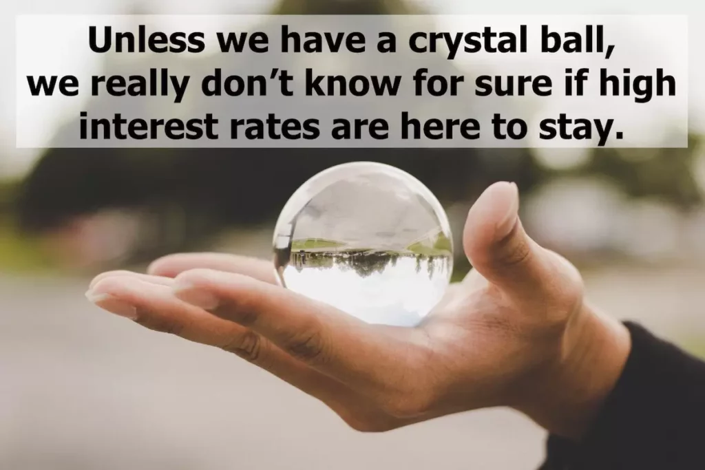 Image of crystal ball in hand with quote: Unless we have a crystal ball, we really don't know for sure if high interest rates are here to stay.