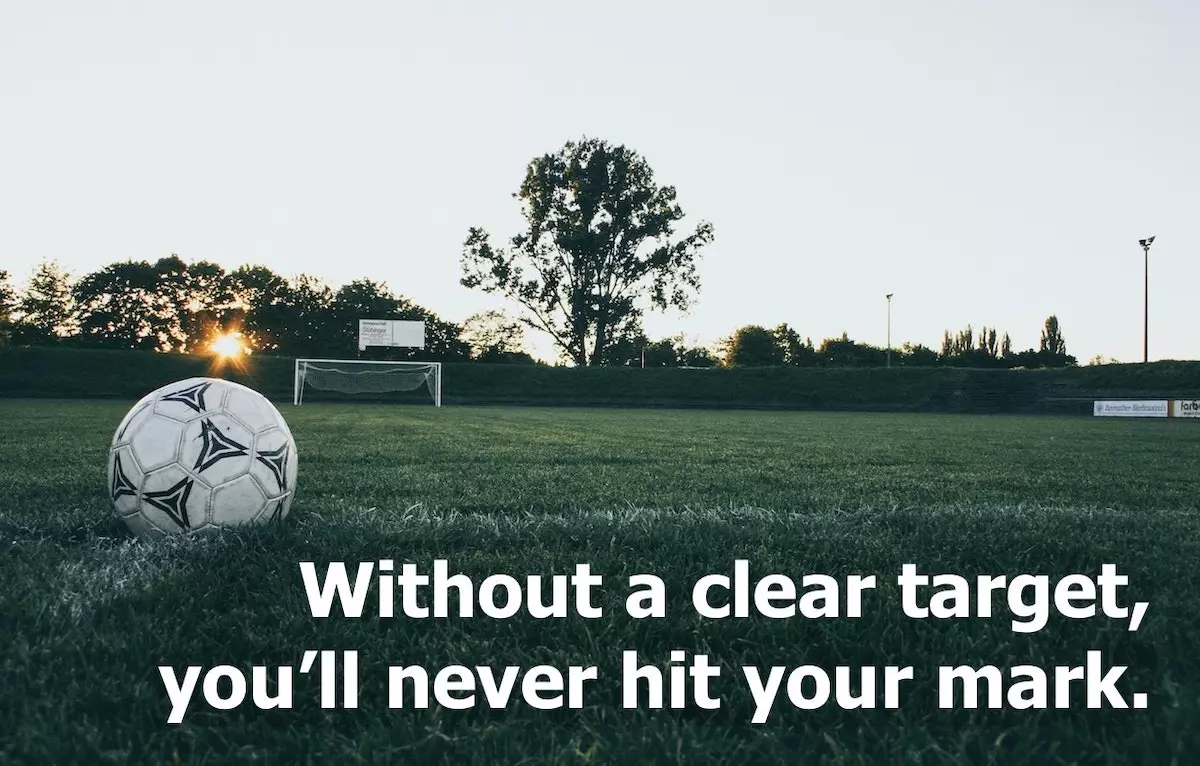 Image of a football in front of a goal post with quote: Without a clear target, you'll never hit your mark.