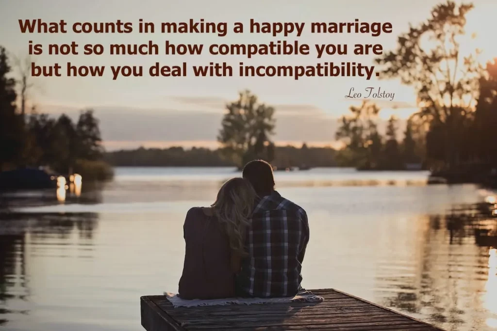 Image of a couple sitting in front of a lake with quote: what counts in making a happy marriage is not so much how compatible you are but how you deal with incompatibility.