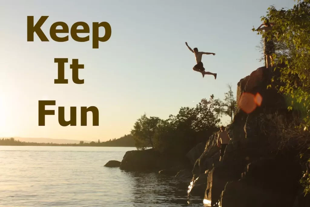 Image of a thrill seeker jumping off a cliff into the sea with the text overlay: keep it fun.