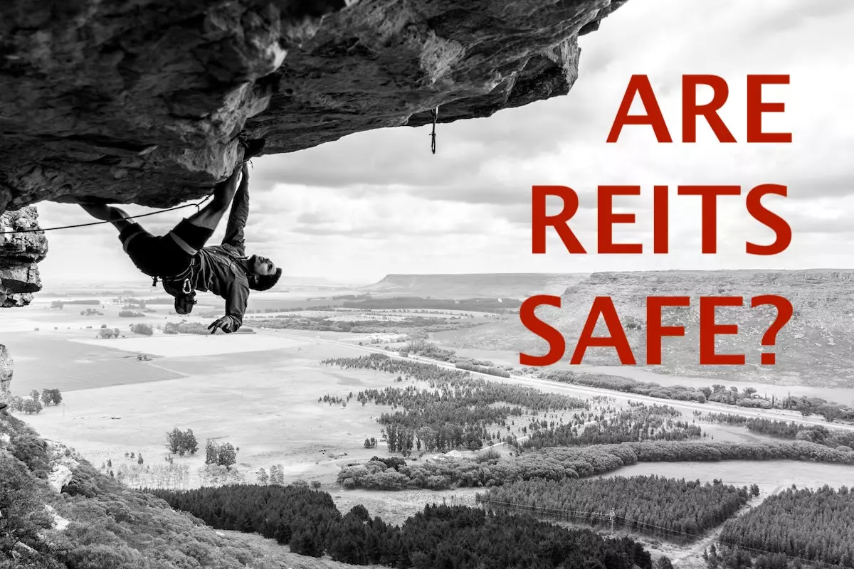 Image of rock climber hanging from a cliff with the text overlay: are REITs safe?