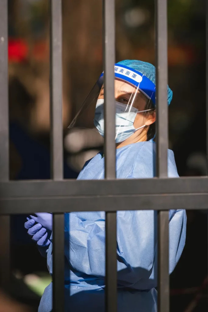 Image of a nurse in protective wear during the covid-19 pandemic lockdown in china.