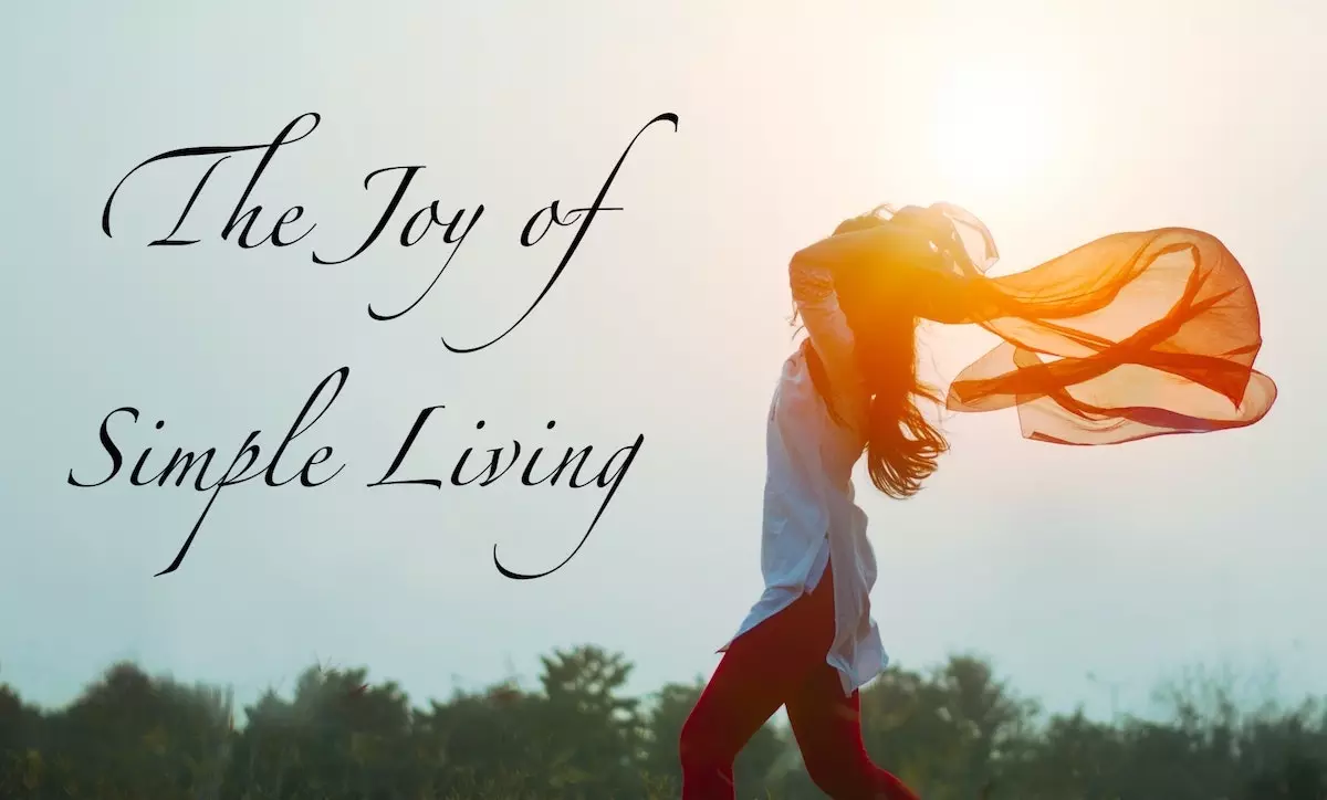 Image of a lady with her scarf blowing in the wind and looking free, with the text overlay: The joy of simple living.