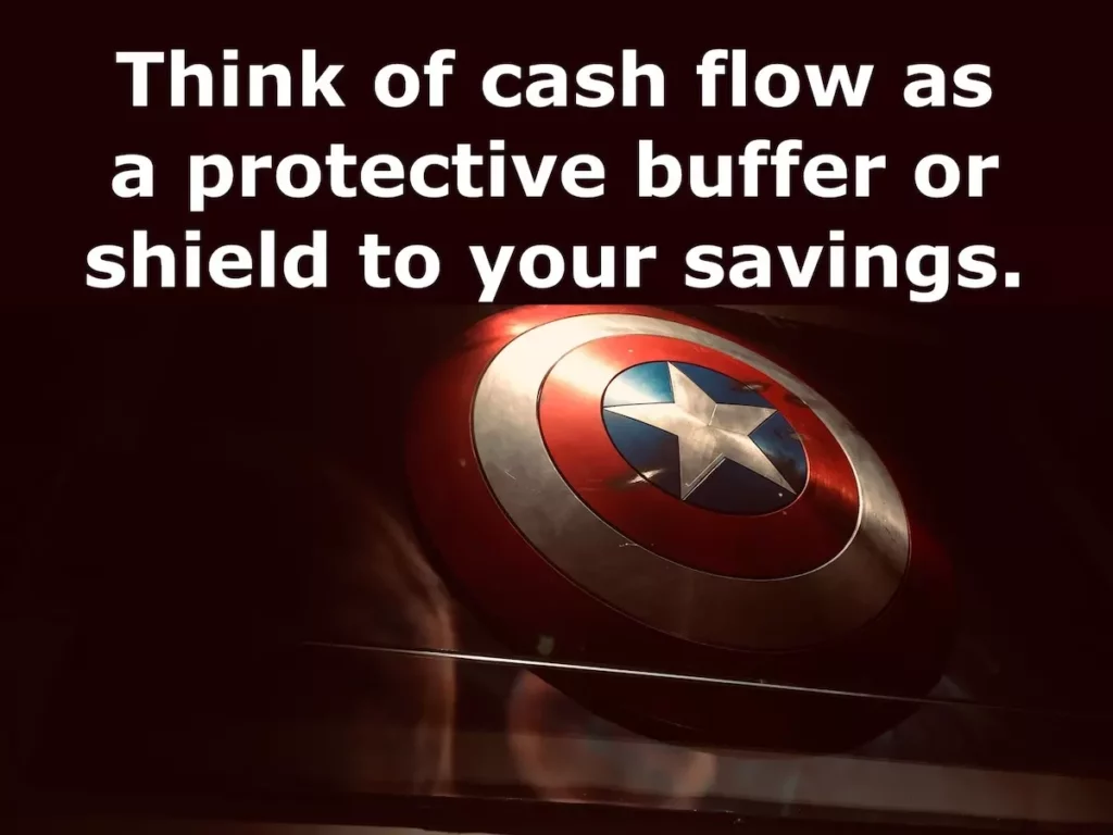 Image of Captain America's shield with the text overlay: Think of cash flow as a protective buffer or shield to your savings.
