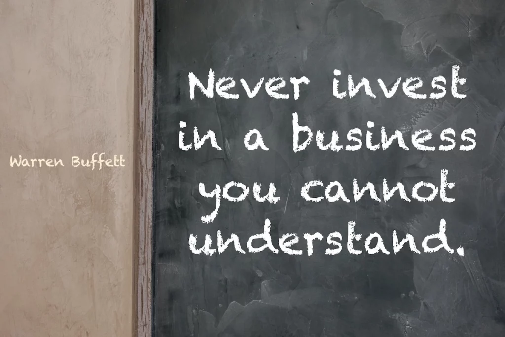 Warren Buffett quote written on a blackboard: Never invest in a business you cannot understand.