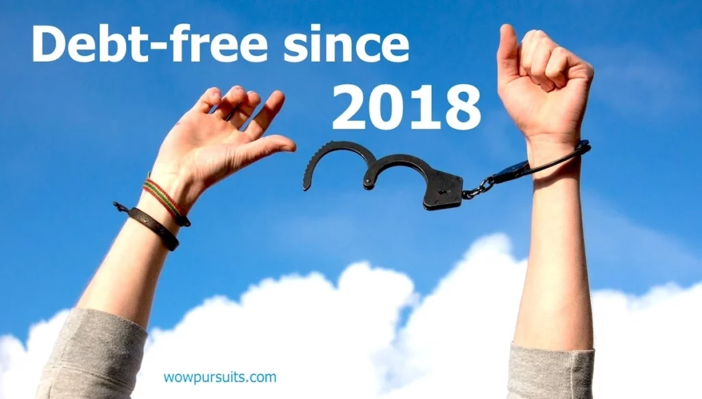 Image of hands breaking free from handcuffs with the text overlay: Debt-free since 2018.