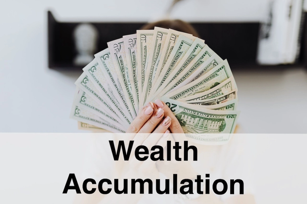 Image of someone holding up a fan of dollar bills with the text overlay: wealth accumulation.