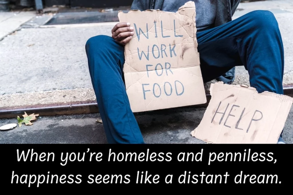 Image of a homeless person with the text overlay: When you're homeless and penniless, happiness seems like a distant dream.