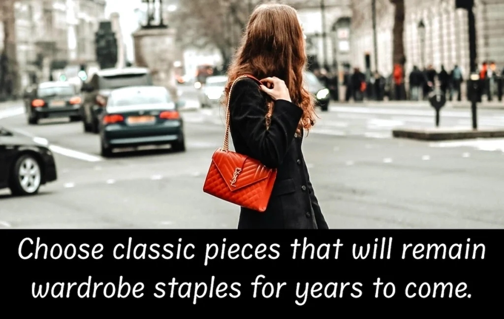 Image of lady carrying a red YSL handbag with the text overlay: Choose classic pieces that will remain wardrobe staples for years to come.